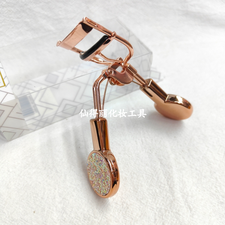 تصویر محصول: 26414仙得丽化妆工具SD-2206A41#亮片圆柄电镀玫瑰金睫毛夹美容夹